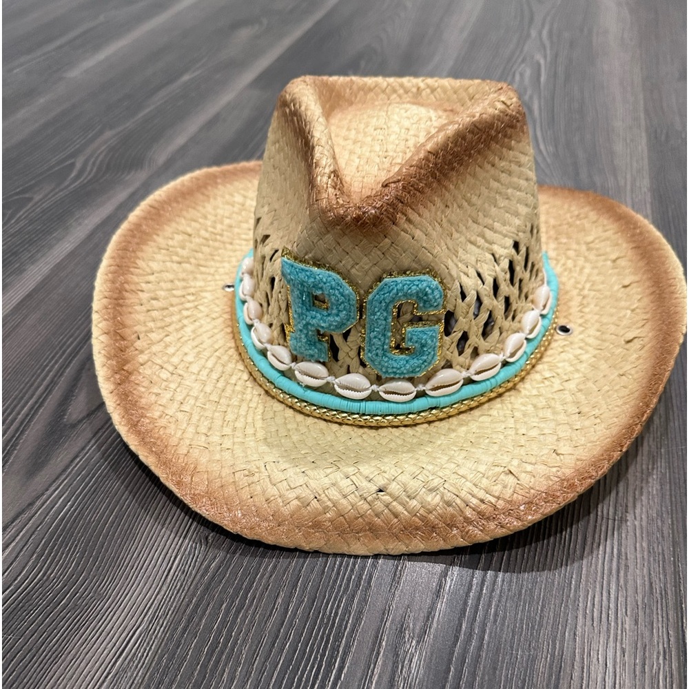 Cowboy hat with teal accessories